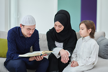 Image showing Young muslim family reading Quran during Ramadan