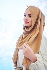 Image showing Girl wearing hijab posing on winter concept background