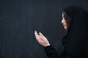 Image showing Portrait of young Muslim woman making dua