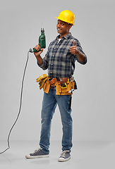 Image showing happy indian builder in helmet with electric drill