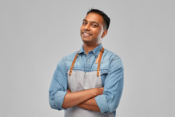 Image showing smiling indian barman, waiter or salesman in apron