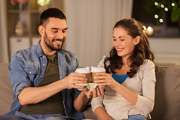 Image showing happy couple drinking tea or coffee at home