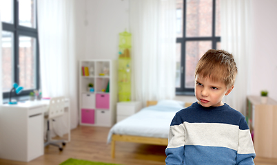 Image showing portrait of gloomy little boy at home