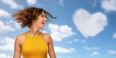 Image showing happy young woman shaking head