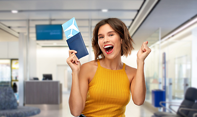 Image showing happy young woman with air ticket and passport