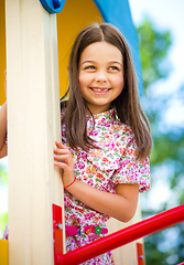 Image showing Cute little girl is playing in playground