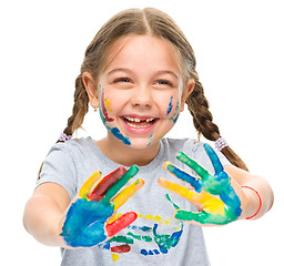 Image showing Portrait of a cute girl playing with paints