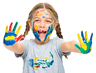 Image showing Portrait of a cute girl playing with paints