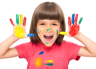 Image showing Portrait of a cute girl playing with paints