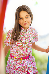 Image showing Cute little girl is playing in playground