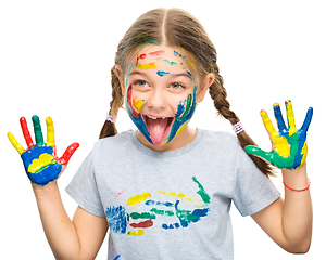 Image showing Portrait of a cute girl playing with paints