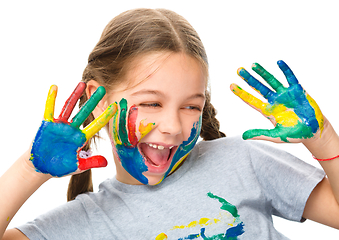 Image showing Portrait of a cute girl playing with paints