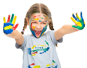 Image showing Portrait of a cute girl playing with paints