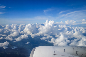 Image showing Airplane flying above clouds