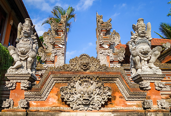 Image showing Statues on a temple entrance door, Ubud, Bali, Indonesia