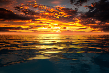 Image showing sunset sky at the ocean background