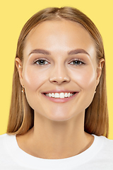 Image showing Caucasian young woman\'s close up shot on yellow background