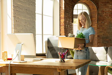 Image showing A young businesswoman moving in office, getting new work place