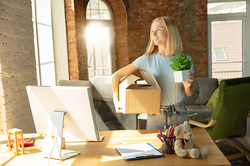 Image showing A young businesswoman moving in office, getting new work place