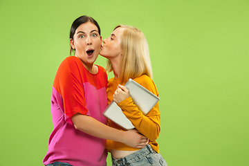 Image showing Portrait of pretty girls isolated on green studio background