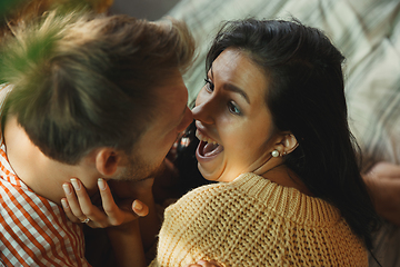 Image showing Couple of lovers at home relaxing together, comfortable