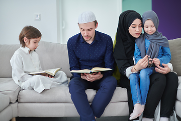 Image showing Young muslim family reading Quran during Ramadan
