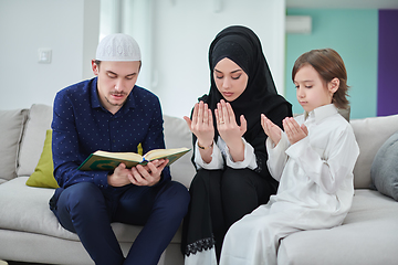 Image showing Young muslim family reading Quran during Ramadan