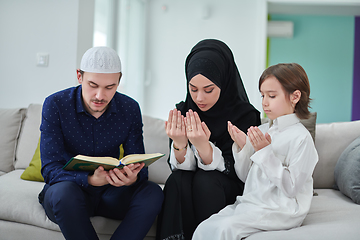 Image showing Young muslim family reading Quran during Ramadan