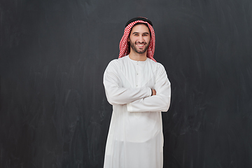 Image showing Young muslim man with crossed arms smiling