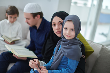 Image showing Young muslim family reading Quran during Ramadan