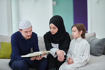 Image showing Young muslim family reading Quran during Ramadan