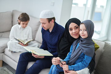 Image showing Young muslim family reading Quran during Ramadan