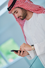 Image showing Portrait of young muslim businessman using mobile phone