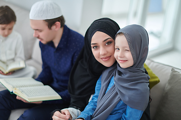 Image showing Young muslim family reading Quran during Ramadan