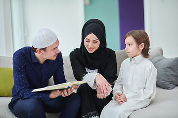 Image showing Young muslim family reading Quran during Ramadan