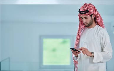 Image showing Portrait of young muslim businessman using mobile phone