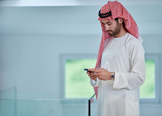 Image showing Portrait of young muslim businessman using mobile phone
