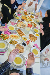 Image showing Muslim family making iftar dua to break fasting during Ramadan