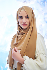 Image showing Girl wearing hijab posing on winter concept background