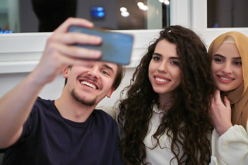 Image showing Young happy, muslims taking selfie in house