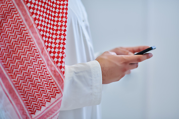 Image showing Portrait of young muslim businessman using mobile phone