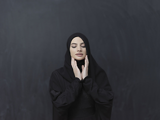 Image showing Portrait of young Muslim woman making dua