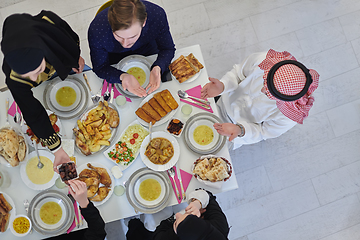 Image showing Top view of muslim family having Iftar during Ramadan holy month