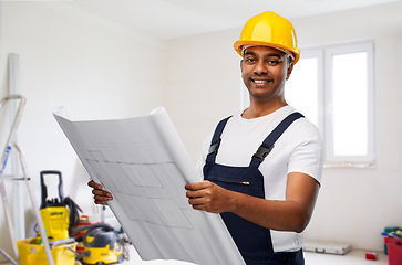 Image showing happy indian builder in helmet with blueprint