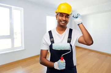 Image showing happy indian painter or builder with paint roller