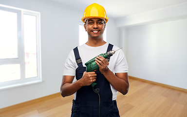 Image showing happy indian builder in helmet with electric drill