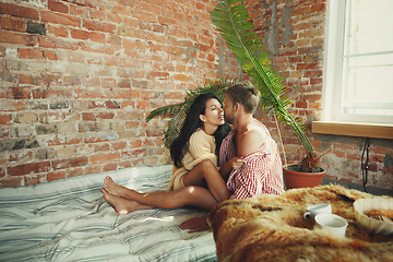 Image showing Couple of lovers at home relaxing together, comfortable