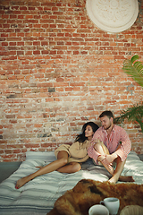 Image showing Couple of lovers at home relaxing together, comfortable