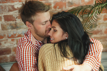 Image showing Couple of lovers at home relaxing together, comfortable