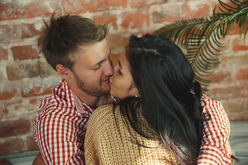 Image showing Couple of lovers at home relaxing together, comfortable